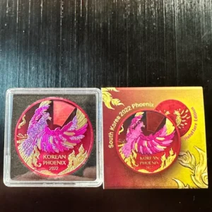 A 2022 Korean Phoenix HoloFlare Edition coin with a Mintage of only 250 and red and pink design on it.