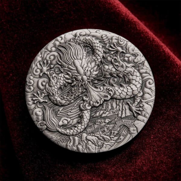 Intricately carved circular metal plaque featuring a dragon design against a velvet background, commemorating the 2024 Australia Lunar Series III Year of the Dragon 2 oz Silver Antiqued Coin.