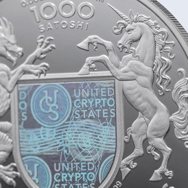 Close-up view of a 2023 United Crypto States Statue of Liberty 1oz Silver Proof Coin 1000 Satoshi with a Statue of Liberty design and the text "united crypto states.