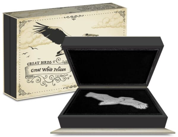An elegant black box with a 2024 Niue Pelican Great Birds Great White 2 oz Silver Proof Coin inside, accompanied by its ornate packaging featuring the text "great birds - great white pelican.